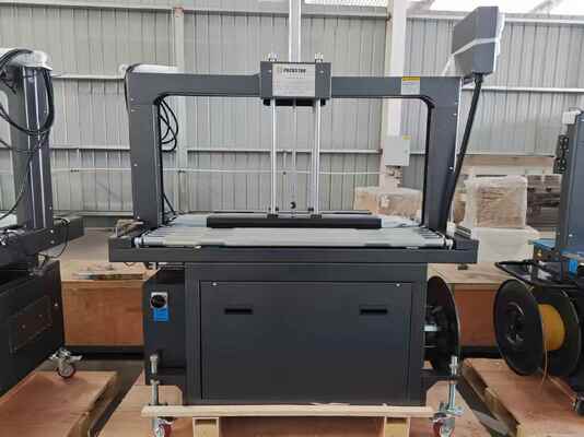 คุณภาพ  Semi-Automatic 1200mm Carton Box Strapping Machine with One Year Warranty for Efficient Packing โรงงาน